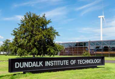 Dundalk Institute of Technology, outside view showing main sign. A wind turbine can be seen in the background